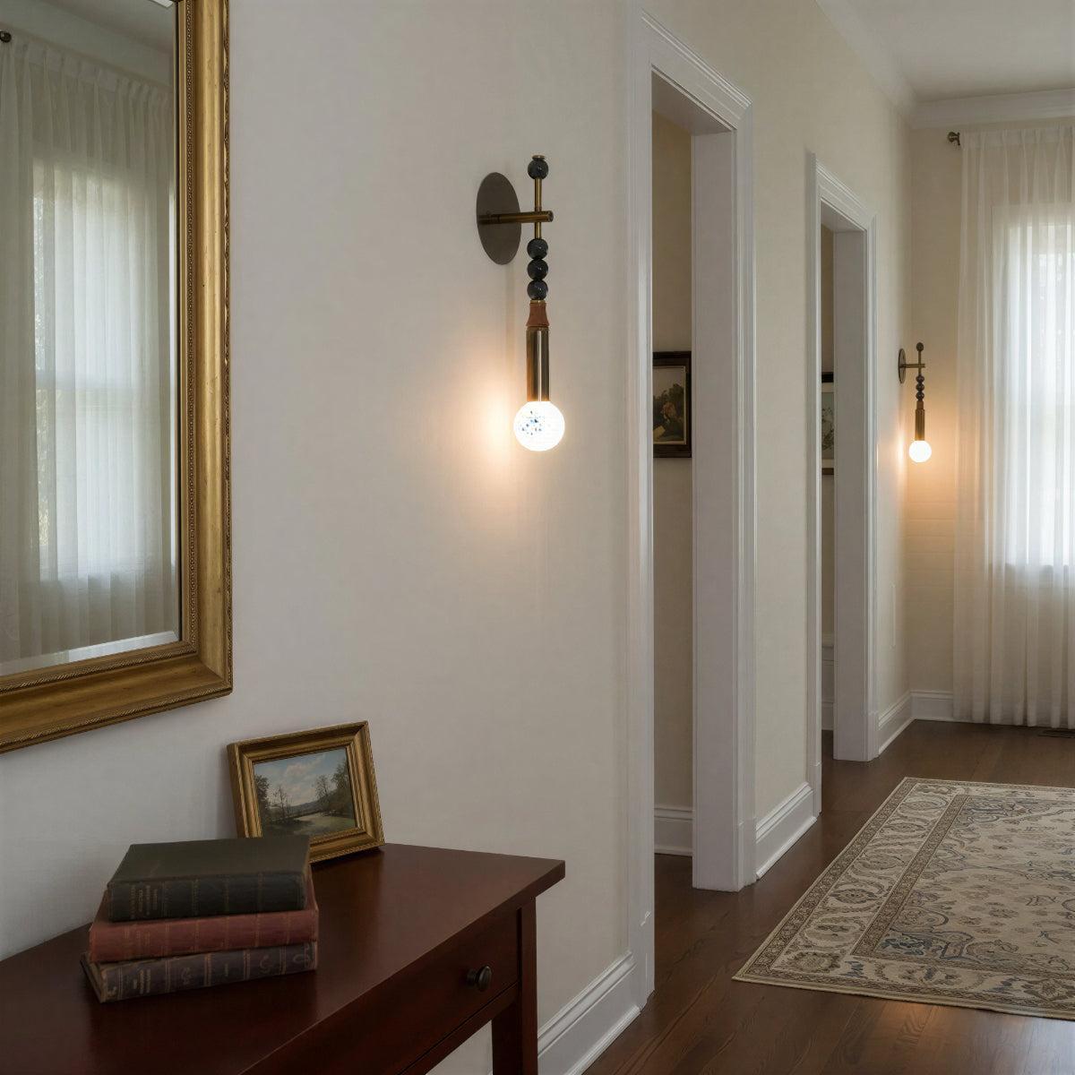 Modern Downward Brass Wall Sconce With Sphere Accents