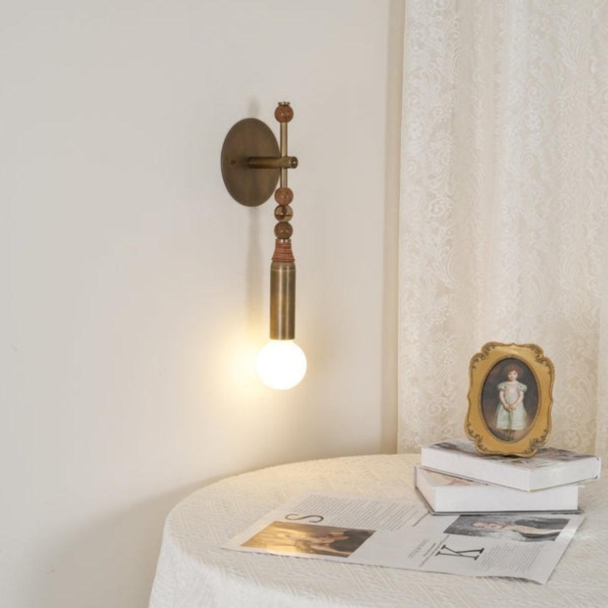 Modern Downward Brass Wall Sconce With Sphere Accents